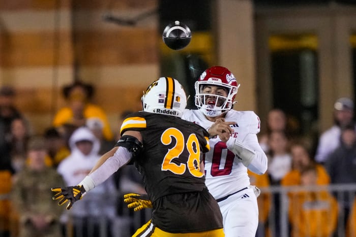 Oct 7, 2023; Laramie, Wyoming, USA; Fresno State Bulldogs quarterback Logan Fife (10) throw against Wyoming Cowboys linebacker Easton Gibbs (28) during the fourth quarter at Jonah Field at War Memorial Stadium.
